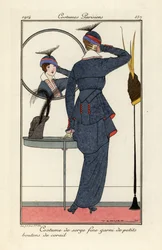 Woman in fine serge suit with coral buttons looking