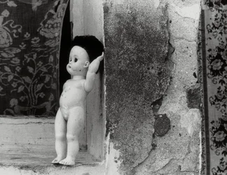 Doll on a Window Sill