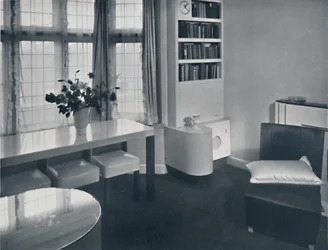 Renovart Ltd: A One-Room Flat with a Useful Corner Fitment Including an Electric Clock
