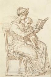 Seated woman showing a book to a small child