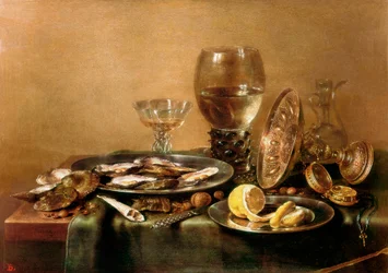 Still life composed of oysters, lemon, glass and gold tableware