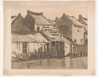 Rear facades of houses along a river in Batavia