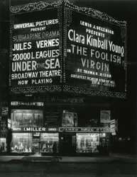 1554 Broadway at 46th Street, I. Miller Shoes; James Drug Store, and Large Marquees for Movies Lit Up Above
