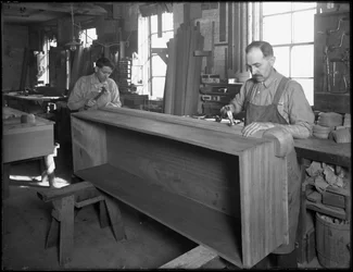 Nailing the base of a wooden casket, Oneida, New York, April 3, 1916