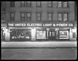 Wide view of the United Electric Light and Power Company window display at W. 138th Street and Hamilton Place, New York City