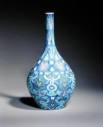 Large bottle shaped vase decorated in the Persian style with intertwined snakes and leaf motifs