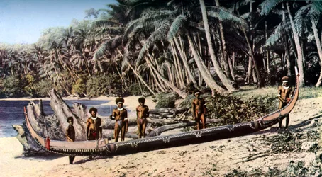 Native canoe on a palm shaded beach, Solomon Islands